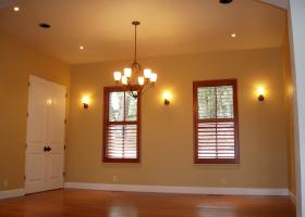 Formal Dining room with wood shutters.