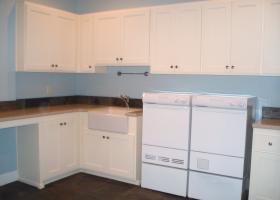 Upstairs laundry/hobby room, with slate floors, silestone counters and apron front sink.