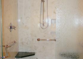 Multi use grab bar locations with seating and chair turn around. Slide bar shower head and hand held option.