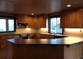 Kitchen with wrap-around counters and custom cabinets
